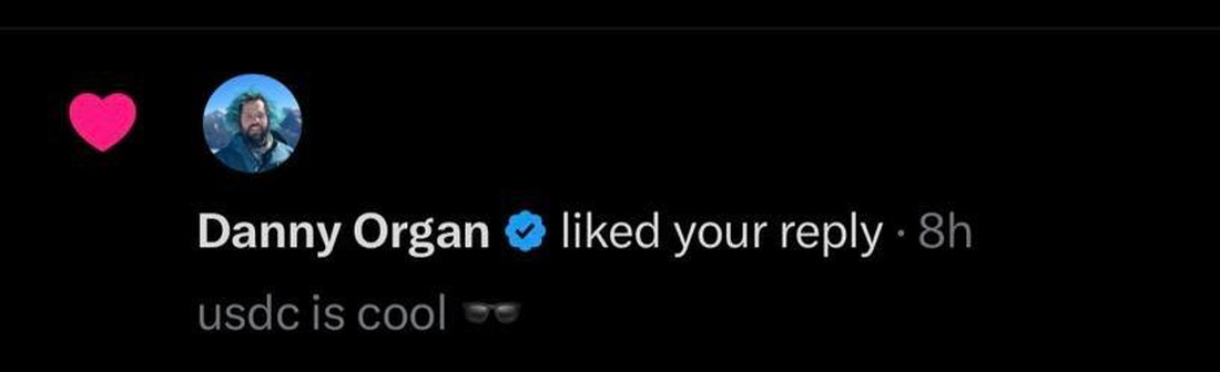 X notification showing Danny Organ liking a usdc is cool reply
